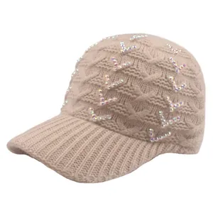 Women's knit baseball cap in beige featuring cable knit pattern and sparkly V-rhinestones