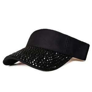 Detail of black rhinestone-embellished sun visor with breathable knit texture