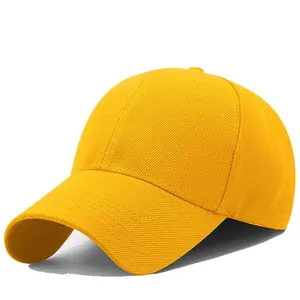 Detail of yellow cotton baseball cap showing twill fabric texture and stitched eyelets