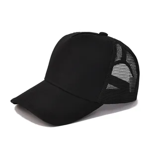 Detail view of a black trucker hat with breathable mesh panels and curved brim