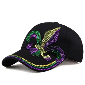 Detailed close-up of a black baseball cap featuring colorful fleur-de-lis rhinestone art