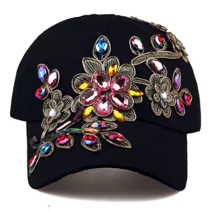 Black baseball cap with colorful rhinestones and gold floral embroidery for sun protection