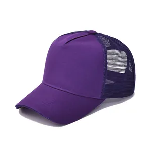 Detail of purple cotton trucker hat featuring breathable mesh panels and stitched brim