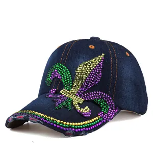 Detailed view of colorful rhinestones on a denim baseball cap with fleur-de-lis motif