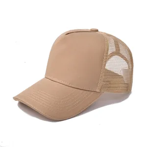 Close-up of khaki cotton trucker hat showing breathable mesh back and fine stitching