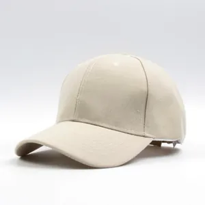 Detail of minimalist beige cotton baseball cap showing twill texture and breathable eyelets