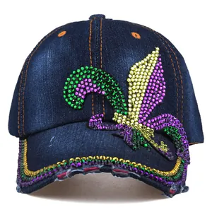 Detail of denim baseball cap with fleur-de-lis rhinestone pattern and colorful brim