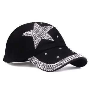 Close-up of black baseball cap with rhinestone star pattern and studded brim detail