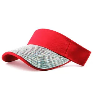 Detailed close-up of red sun visor with rhinestone embellishments on the brim