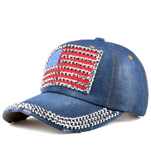 Detailed close-up of rhinestones and American flag patch on a denim baseball cap