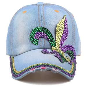 Detailed view of colorful rhinestone fleur-de-lis pattern on blue denim baseball cap