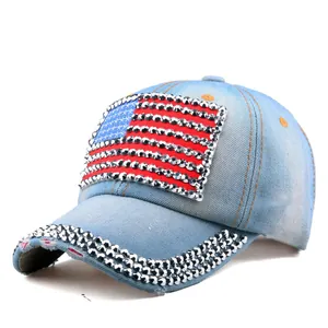 Close-up of sparkling rhinestones and distressed denim texture on US flag baseball cap