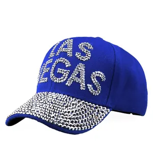 Royal blue baseball cap with silver rhinestone LAS VEGAS lettering and sparkling brim