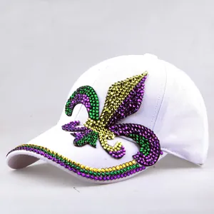 Detailed shot of white baseball cap with colorful rhinestones in a fleur-de-lis pattern