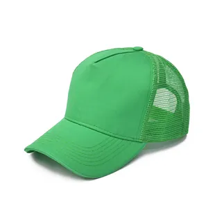 Detailed close-up of bright green mesh trucker hat with breathable fabric and curved brim