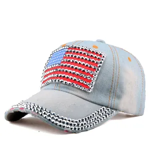 Detailed side view of washed denim baseball cap with rhinestone US flag and star accents