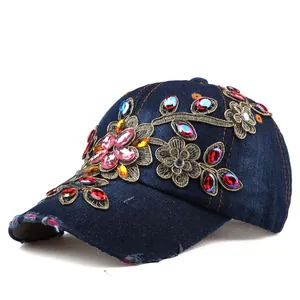 Macro shot of colorful rhinestones and floral embroidery on a denim baseball cap