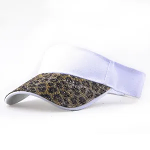 Detail of white cotton visor hat featuring leopard print rhinestone sequined brim