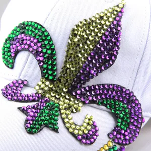 Baseball cap with colorful fleur-de-lis rhinestone pattern in purple and green crystals