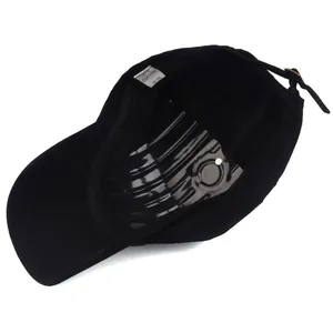 Detail view of the 100% cotton inner lining and adjustable metal buckle on black cap