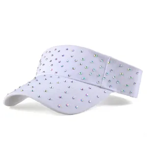 Close-up of sparkling rhinestones on the brim of a white summer sun visor hat