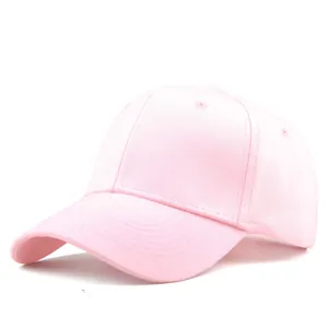 Detail view of pink cotton baseball cap with six-panel construction and curved brim