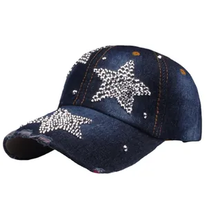 Distressed dark blue denim baseball cap with rhinestone stars and metal studs