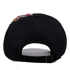 Rear view of black cotton baseball cap with colorful rhinestones and adjustable strap
