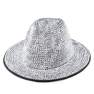 Detailed view of silver rhinestone embellishments and black trim on a wool jazz hat