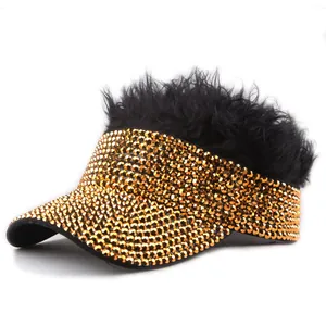 Detail of sparkling gold rhinestones and black artificial wig on creative sun hat