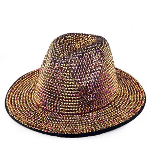 Macro detail of hand-applied golden rhinestones on a vintage wool felt jazz fedora hat