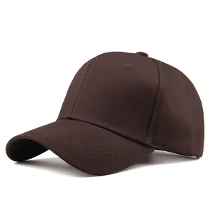 Detailed close-up of brown cotton baseball cap showing six-panel stitching and air vents