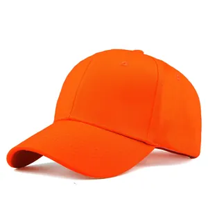 Detail of a bright orange cotton baseball cap showing 6-panel stitching and curved brim