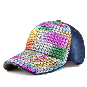 Detail of colorful rhinestone stripes and distressed denim brim on baseball cap