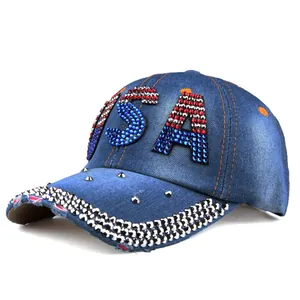 Detailed macro view of denim baseball cap with rhinestone USA letters and studded brim