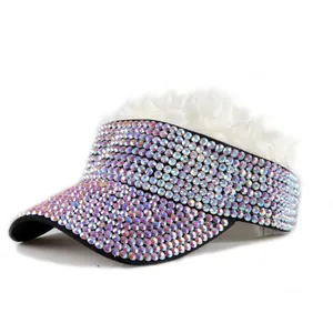 Detail of colorful rhinestones on a sun visor hat with white faux fur top decoration