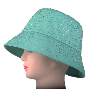 Mint green bucket hat with sparkling rhinestones shown from a stylish side angle