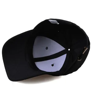 Internal view of black cotton baseball cap showing reinforcement and metal buckle
