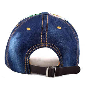 Rear view of navy denim baseball cap with colorful sequins and adjustable leather strap
