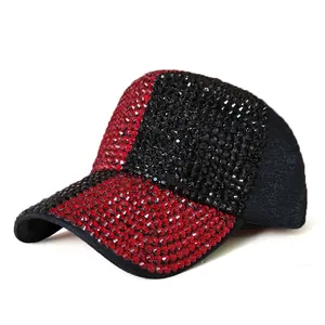 Close-up of sparkling rhinestones on red and black baseball cap with sequin details