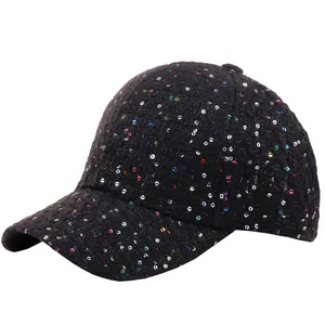 Close-up of black tweed baseball cap with colorful sequins and woven texture details