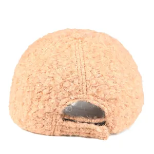 Detail view of the back of a thick camel teddy fleece baseball cap with adjustable strap