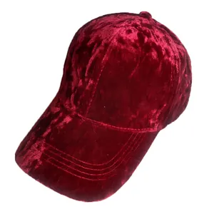 Detailed view of burgundy velvet baseball cap showing parallel brim stitching and texture