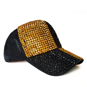 Detailed view of shimmering gold and black rhinestones on a stylish baseball cap