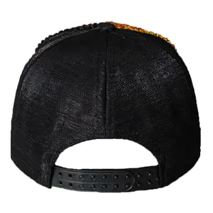 Detail of black baseball cap snapback closure with sparkling orange rhinestones on top
