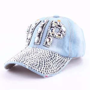 Close-up of VIP rhinestone lettering and silver diamond-studded denim baseball cap brim