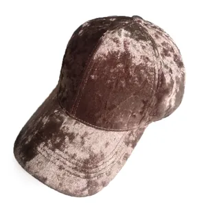 Detailed view of the velvet baseball cap showing the crushed texture and curved brim