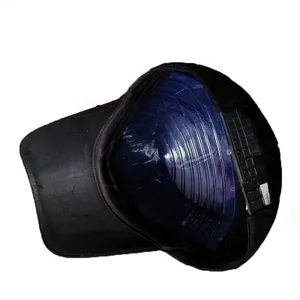 Detailed macro view of black cotton baseball cap interior with adjustable strap and label