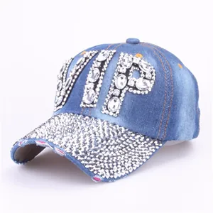 Detailed view of VIP rhinestone lettering and sparkling crystal denim baseball cap brim