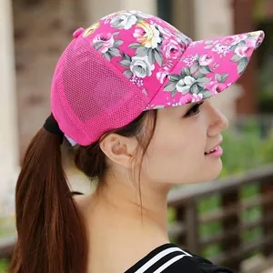 Detail of rose red floral baseball cap showing breathable mesh panels and side view on model